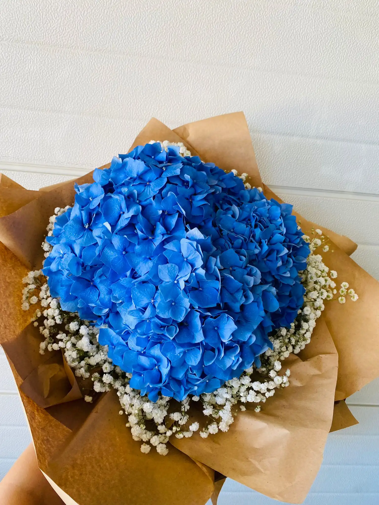 Hand-tied bouquet with carefully arranged flowers.