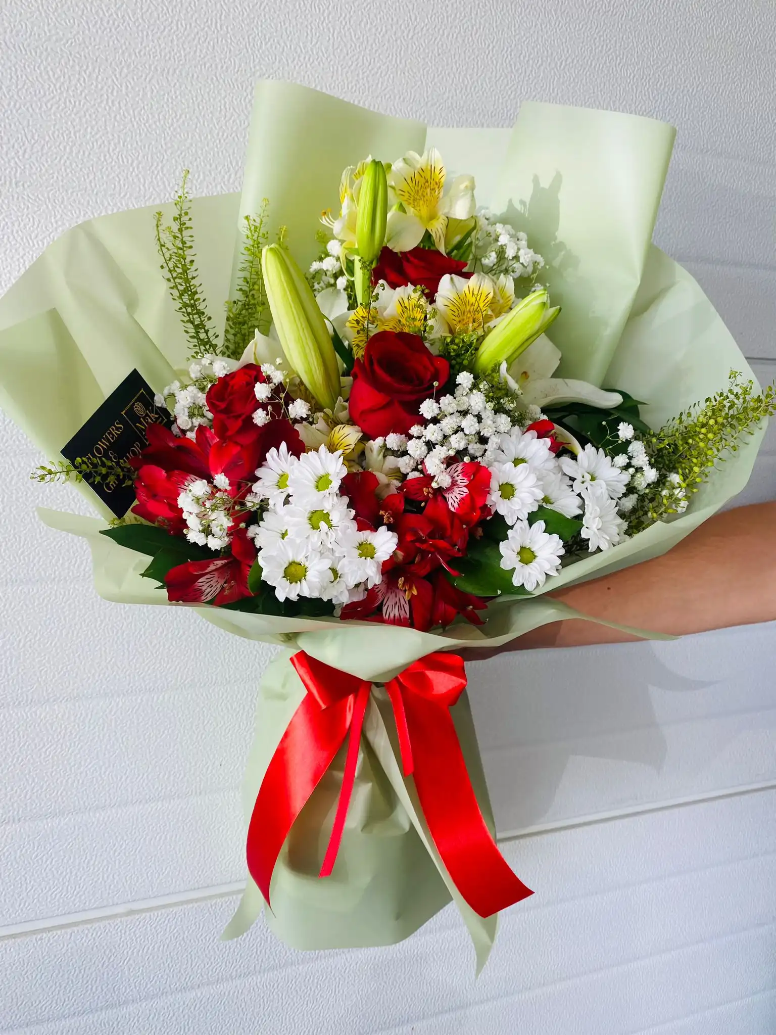 Hand-tied bouquet with carefully arranged flowers.