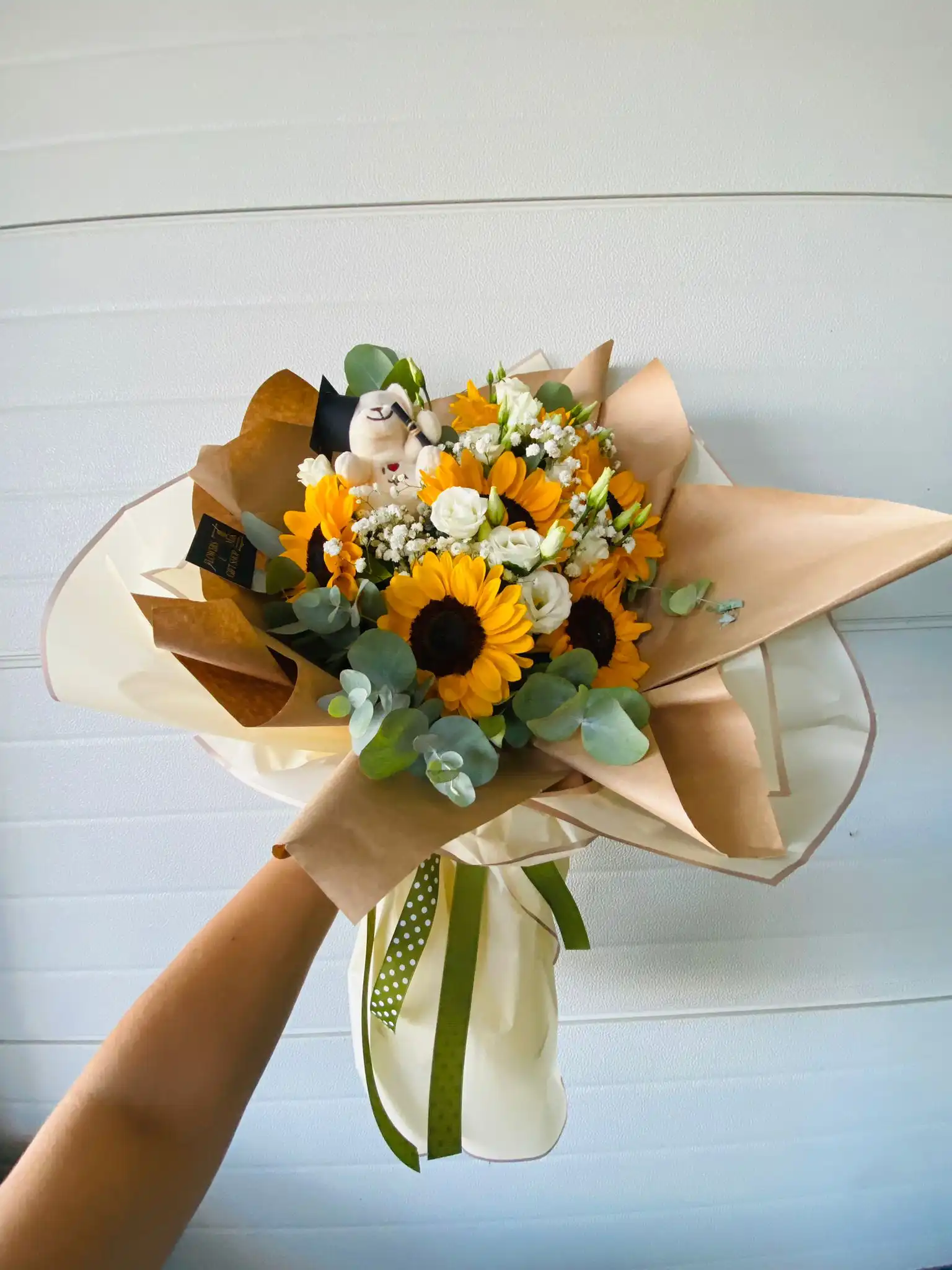 Hand-tied bouquet with carefully arranged flowers.