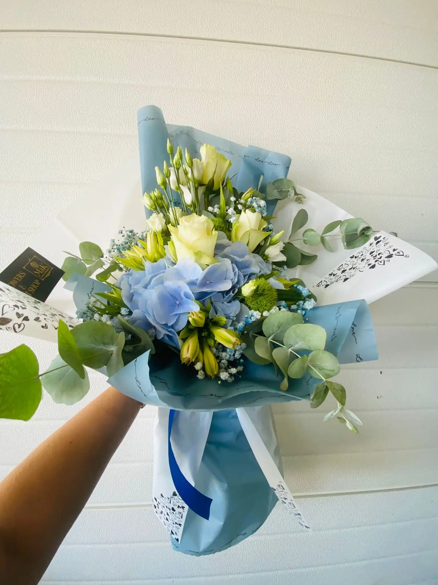 Hand-tied bouquet with carefully arranged flowers.
