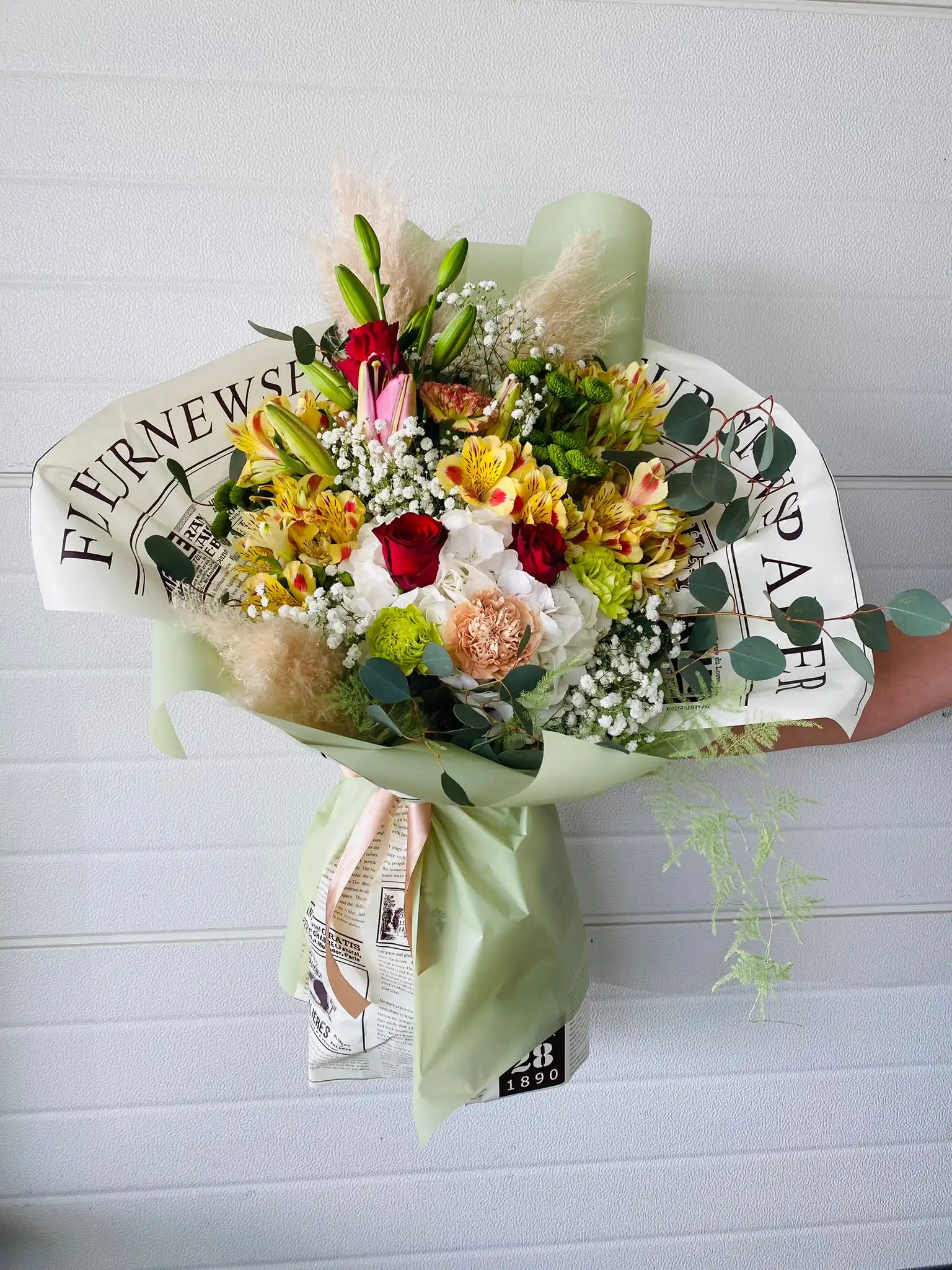 Hand-tied bouquet with carefully arranged flowers.