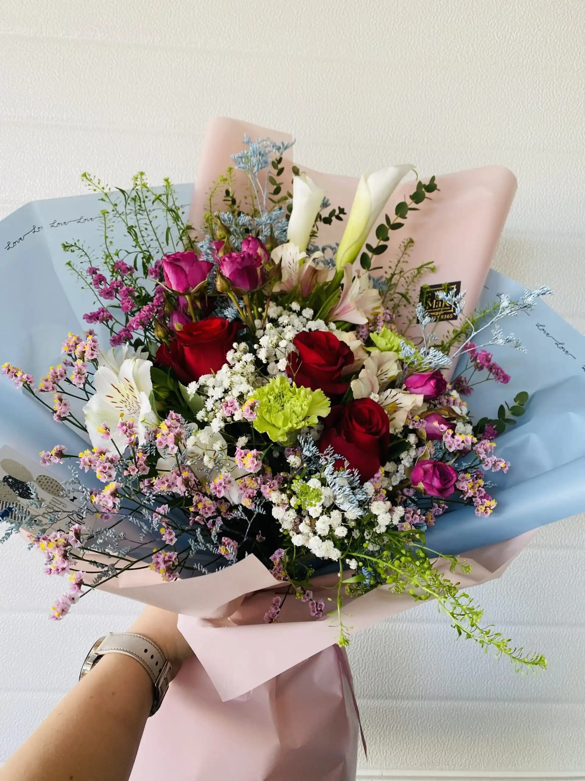 Hand-tied bouquet with carefully arranged flowers.