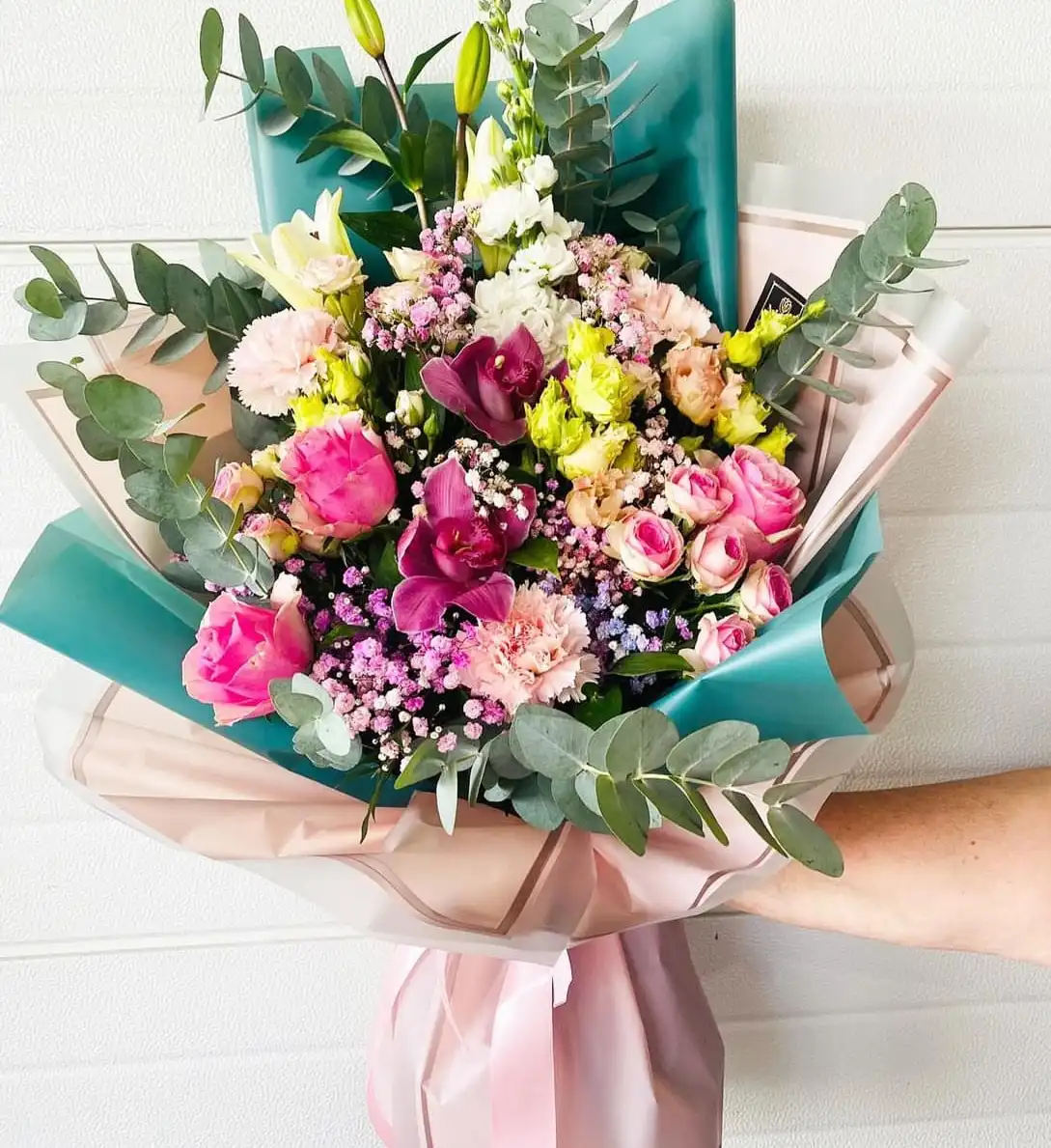 Hand-tied bouquet with carefully arranged flowers.