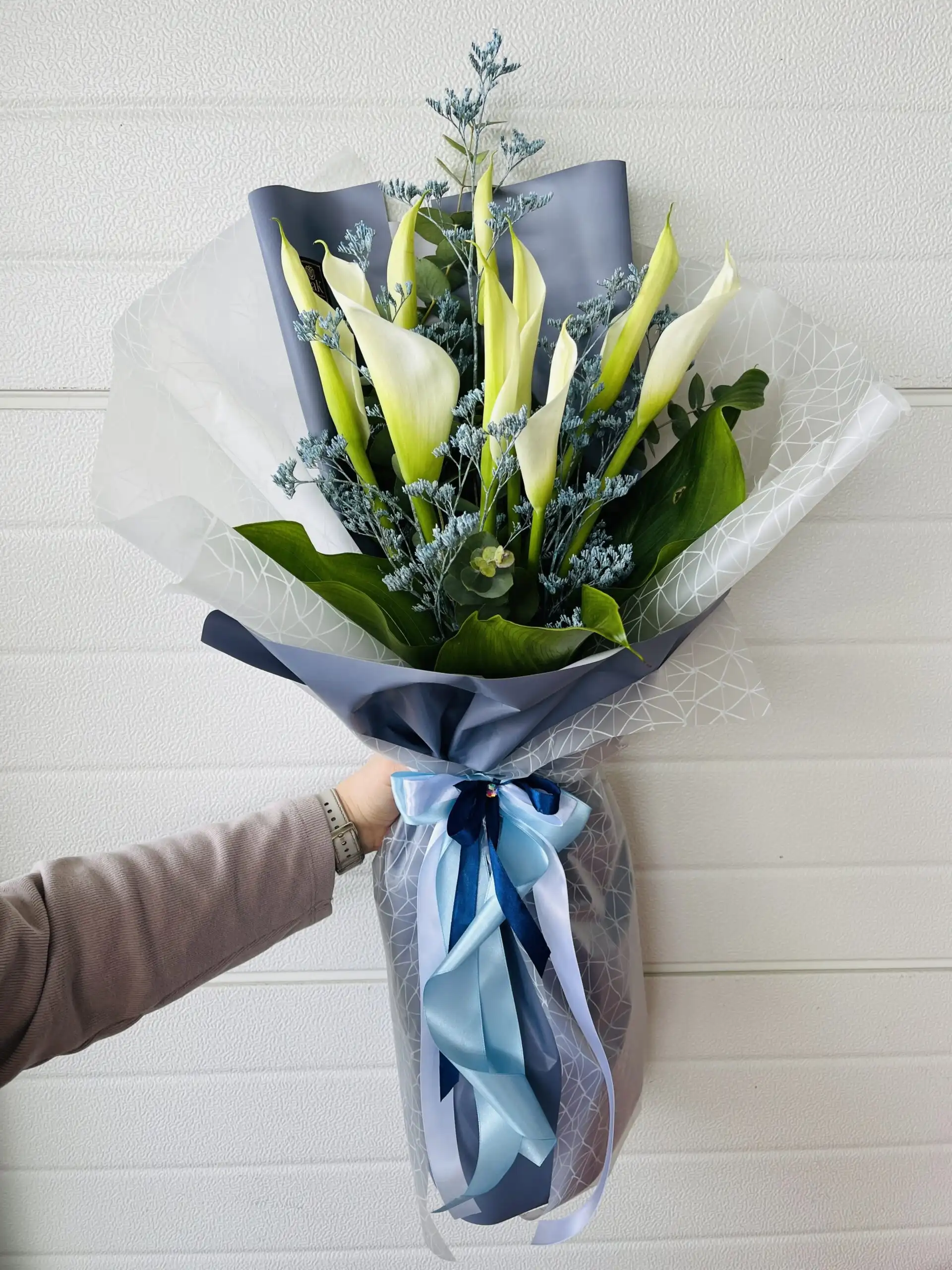 Hand-tied bouquet with carefully arranged flowers.