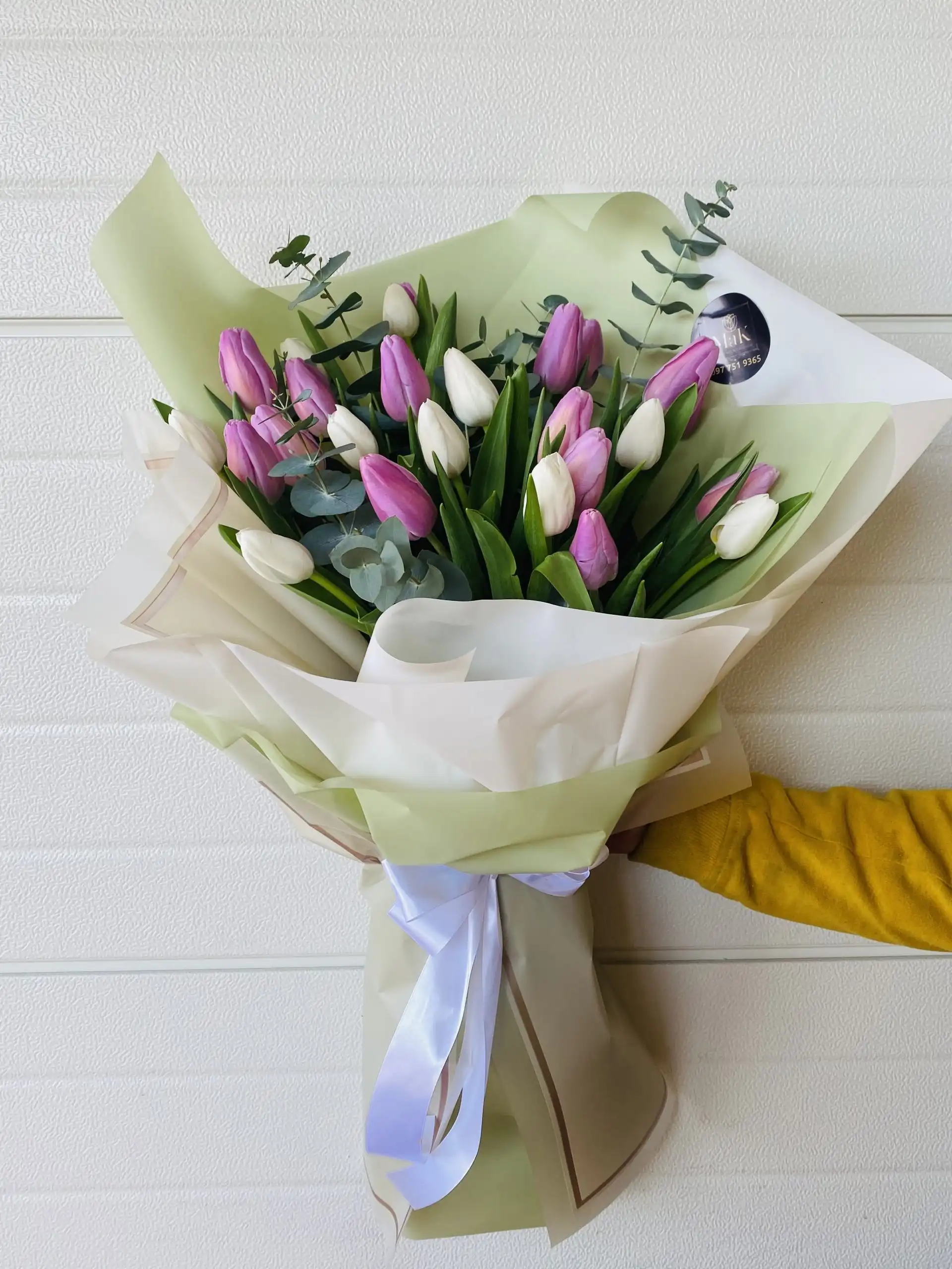 Hand-tied bouquet with carefully arranged flowers.