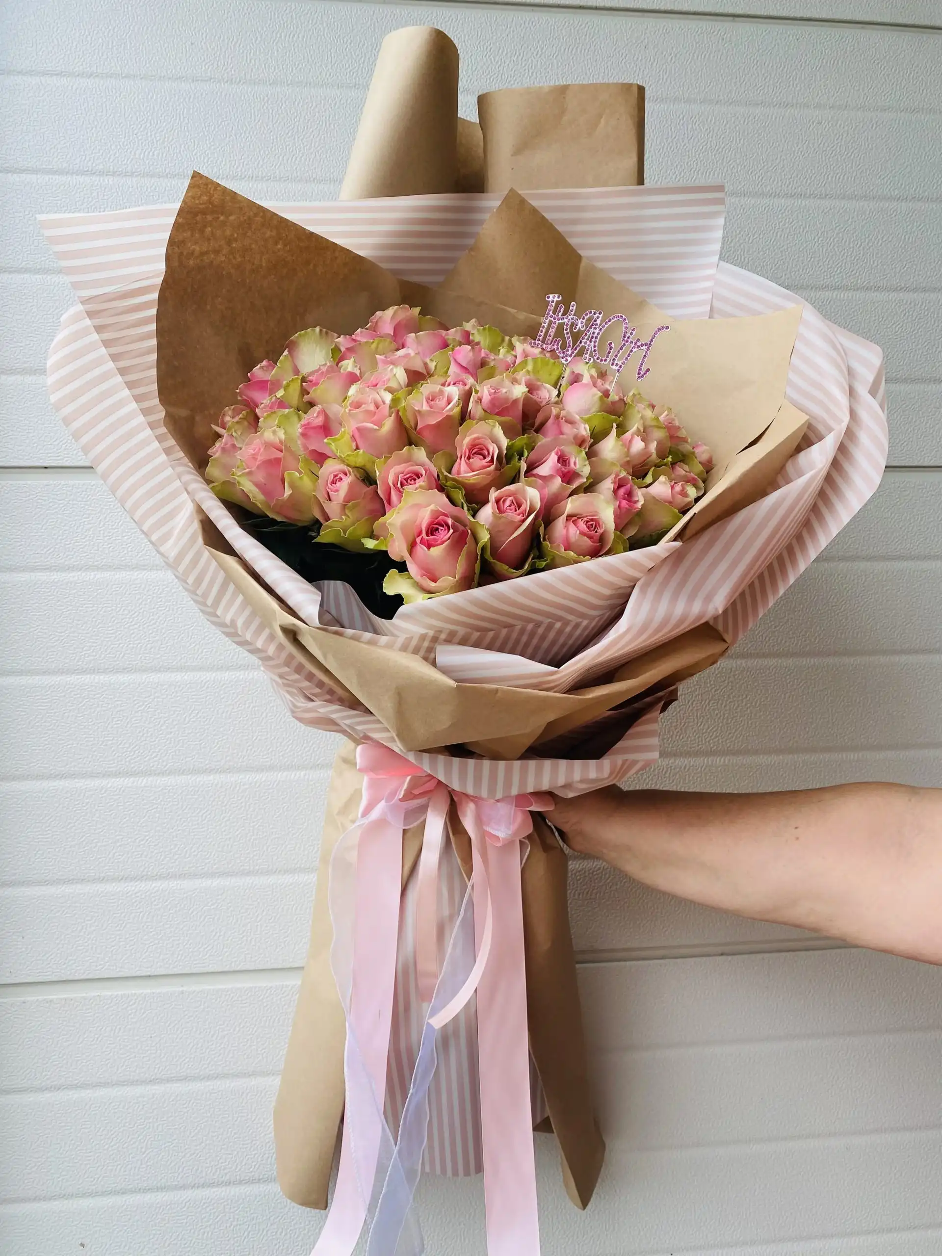 Hand-tied bouquet with carefully arranged flowers.