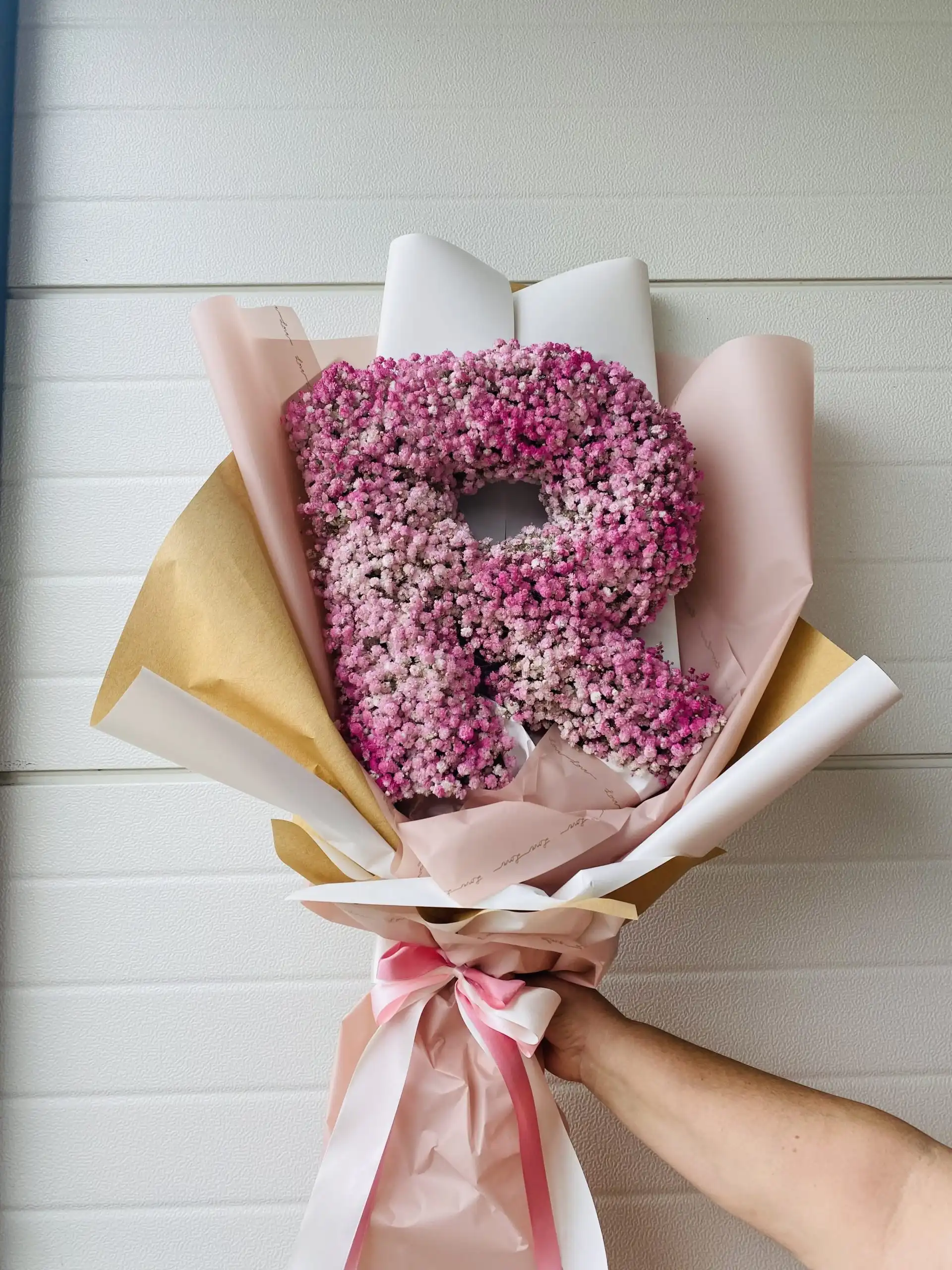 Hand-tied bouquet with carefully arranged flowers.