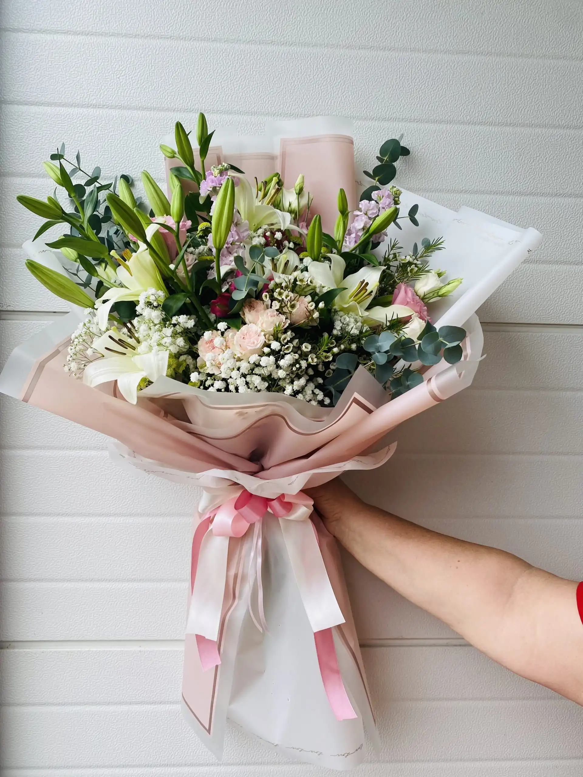 Hand-tied bouquet with carefully arranged flowers.