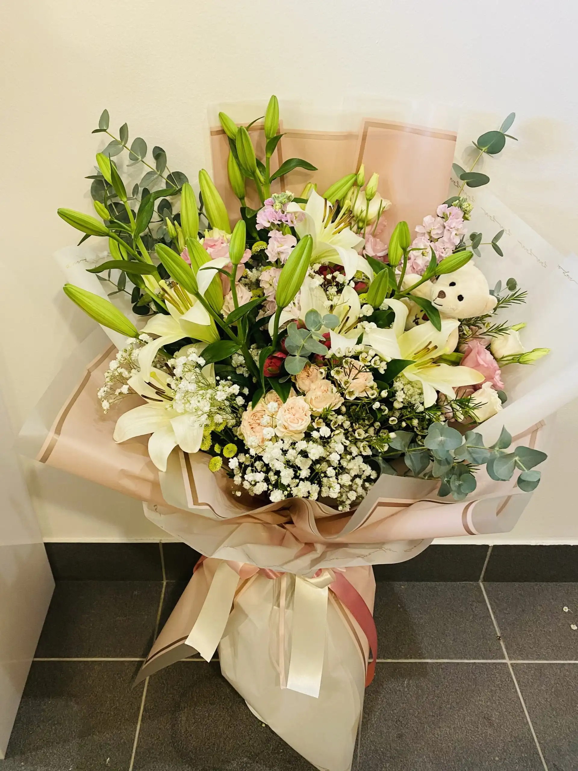 Hand-tied bouquet with carefully arranged flowers.