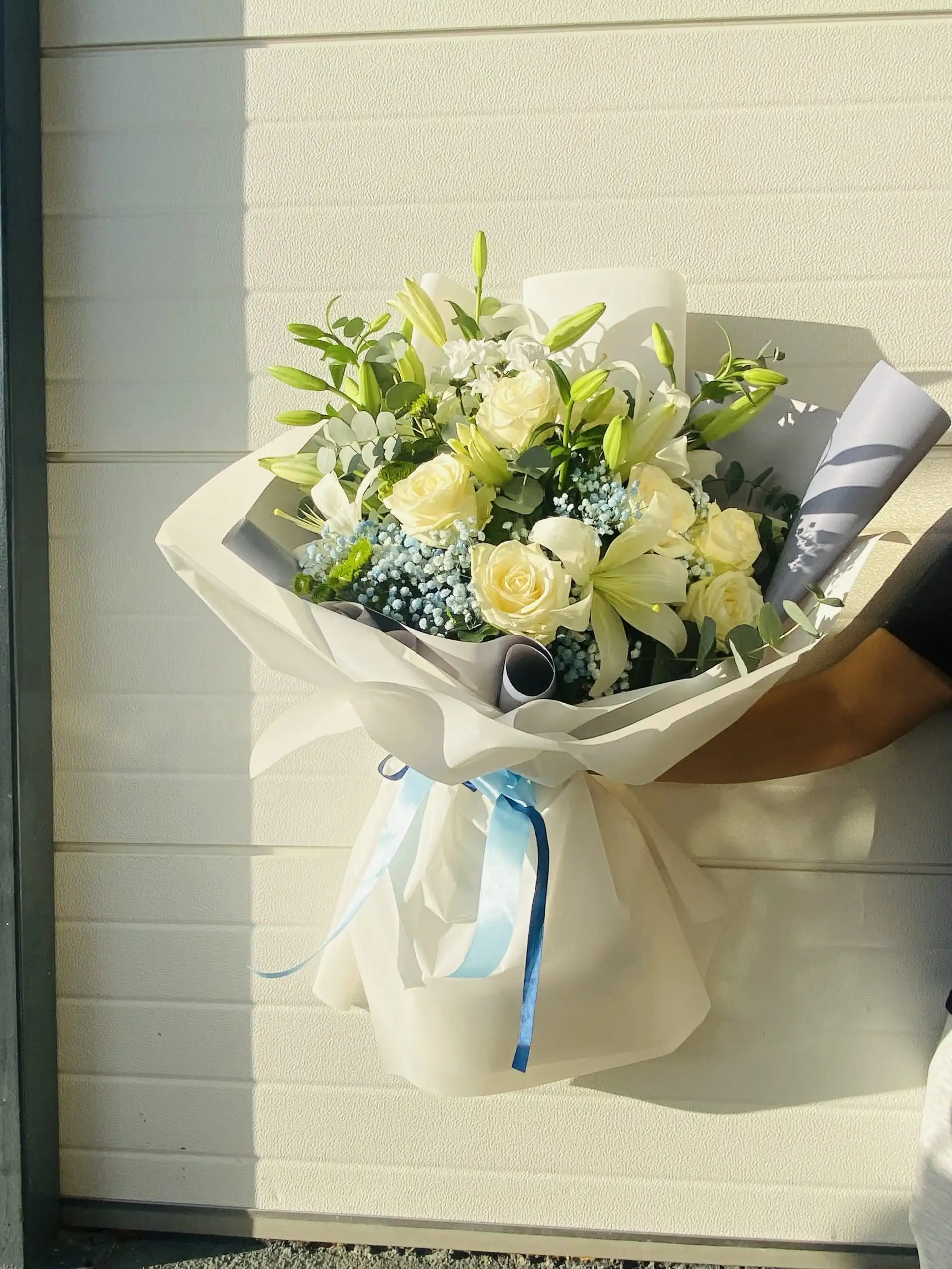 Hand-tied bouquet with carefully arranged flowers.