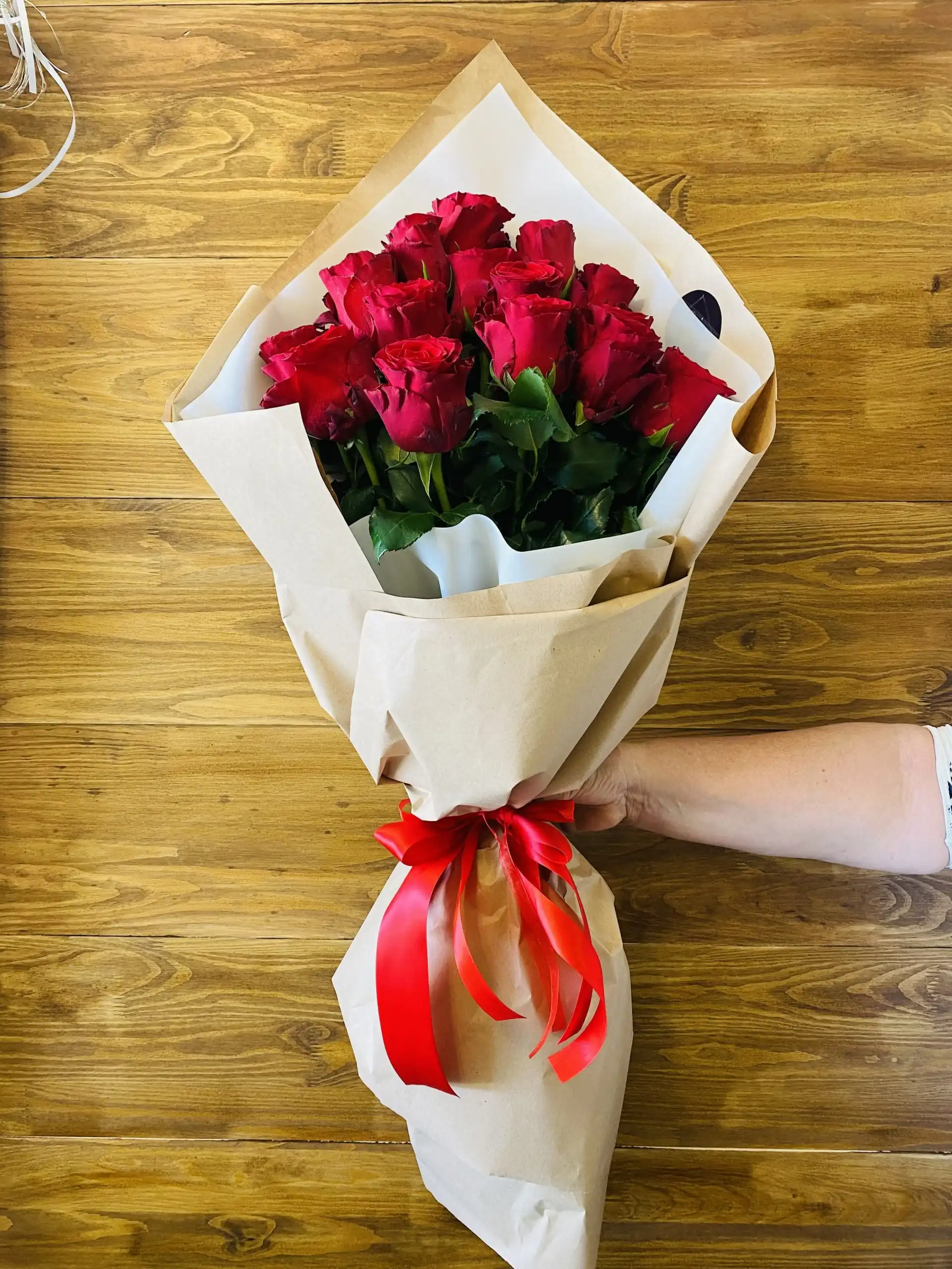 Hand-tied bouquet with carefully arranged flowers.