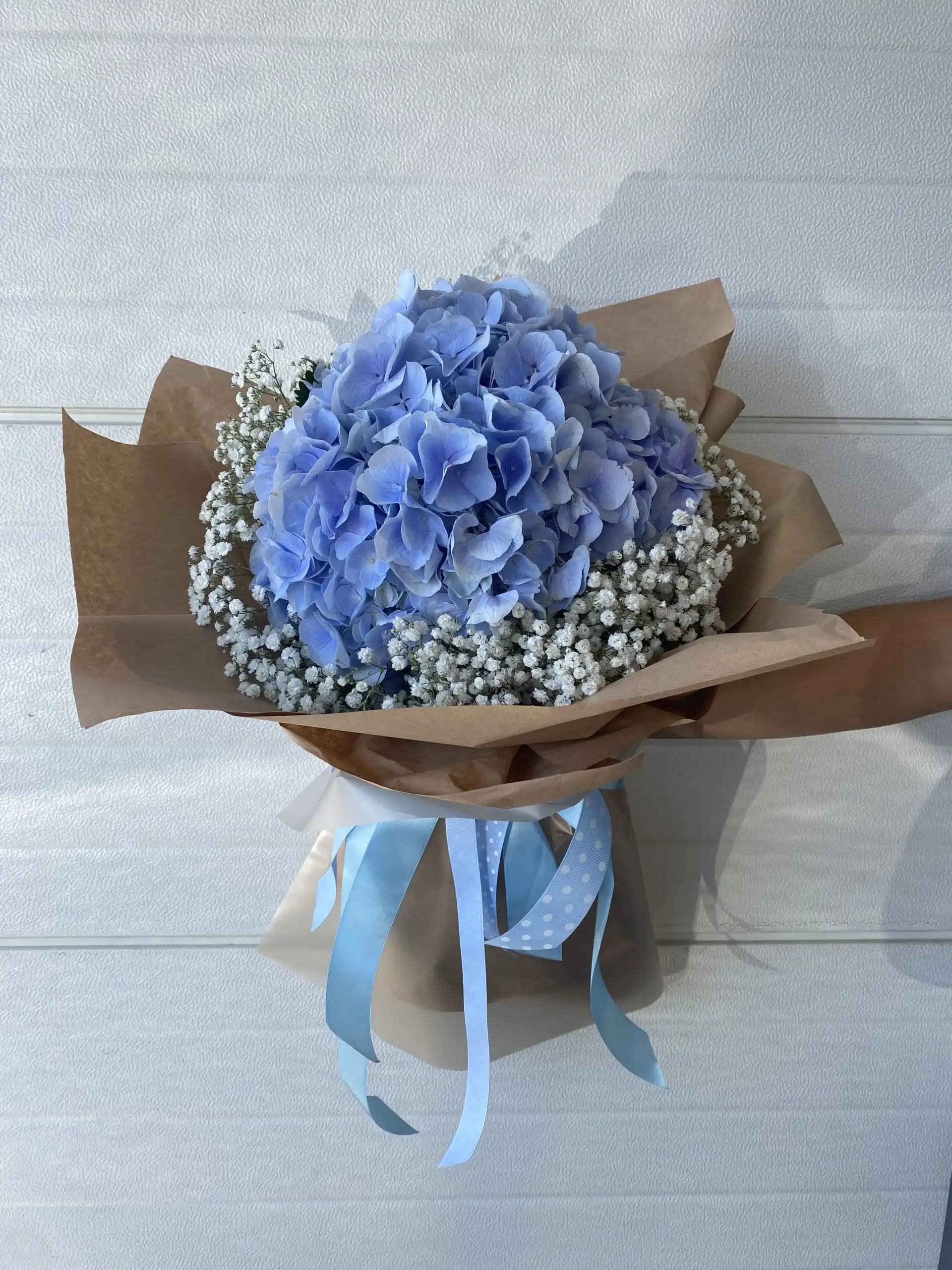 Hand-tied bouquet with carefully arranged flowers.