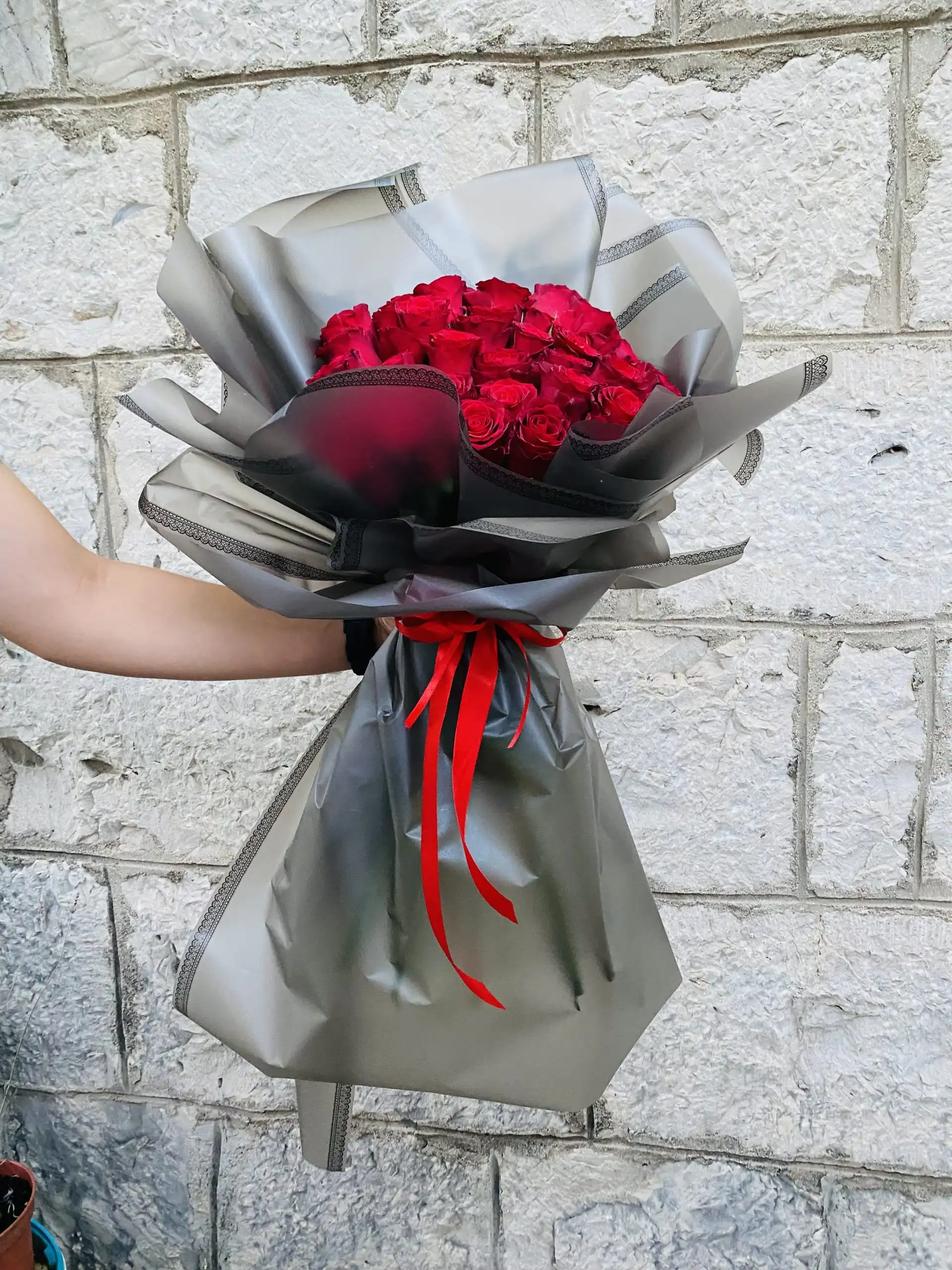 Hand-tied bouquet with carefully arranged flowers.