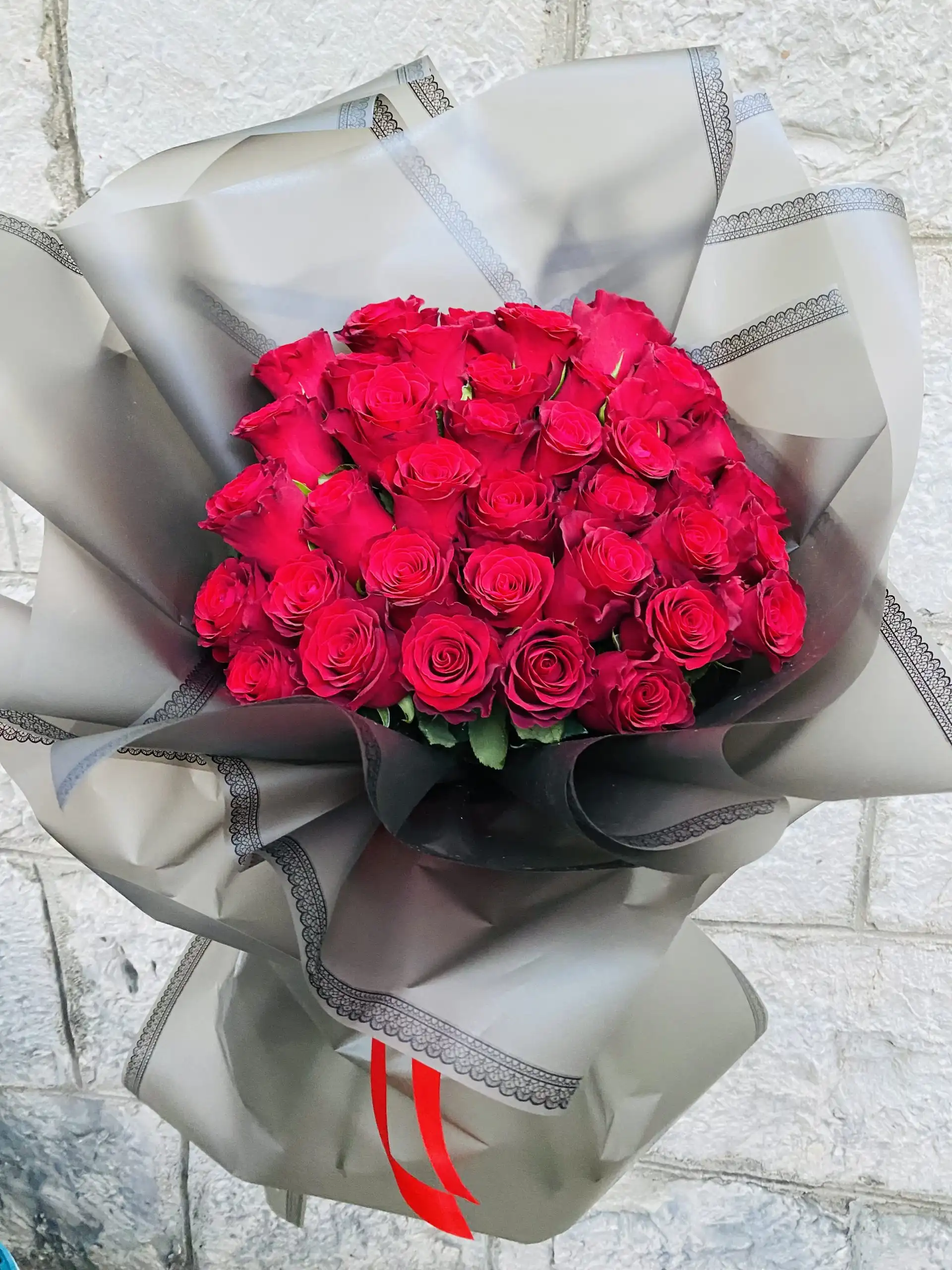 Hand-tied bouquet with carefully arranged flowers.