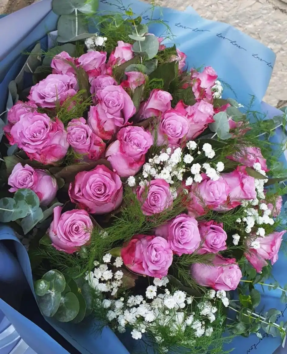 Hand-tied bouquet with carefully arranged flowers.