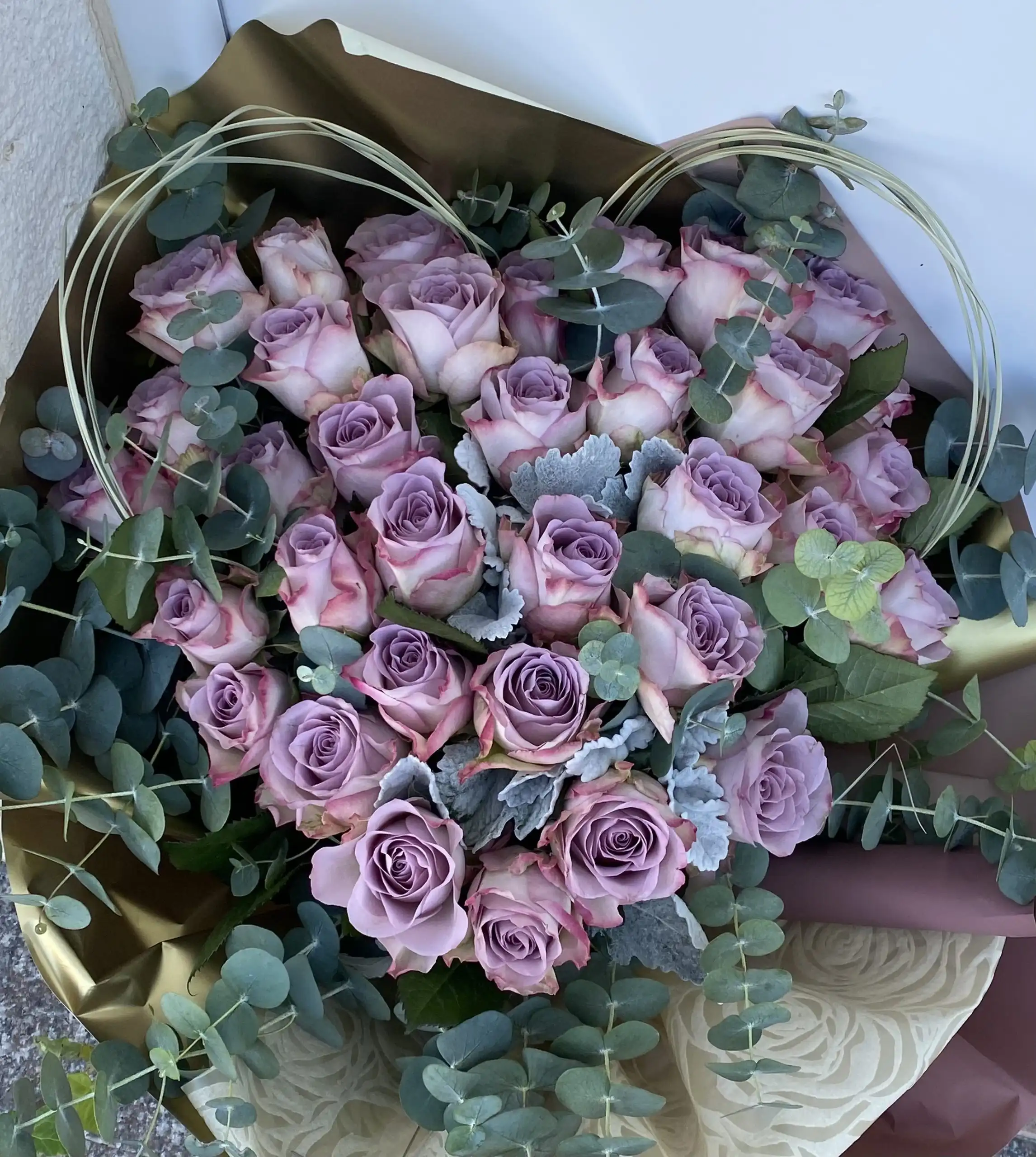 Hand-tied bouquet with carefully arranged flowers.
