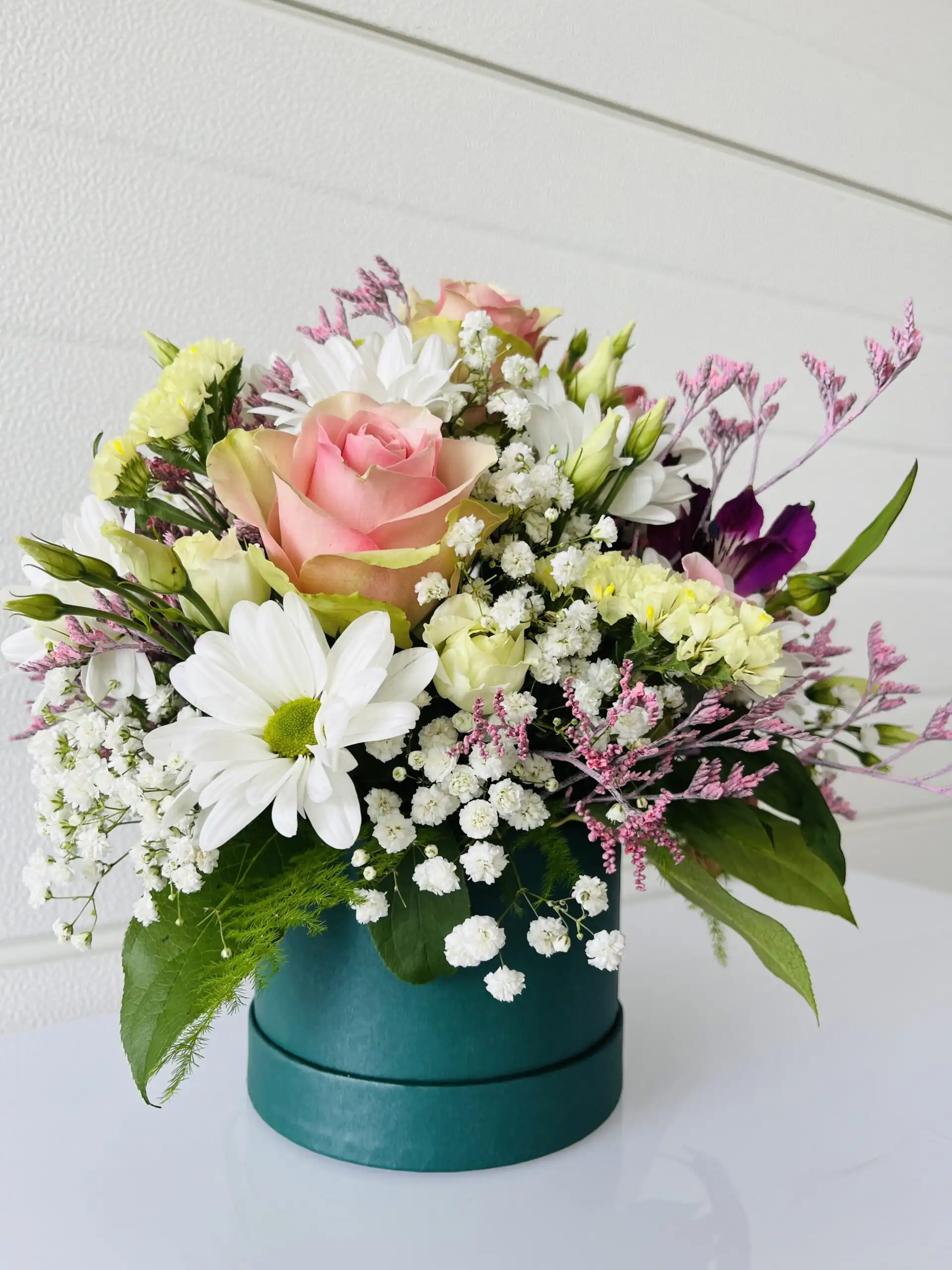 Floral arrangement in a flower box.